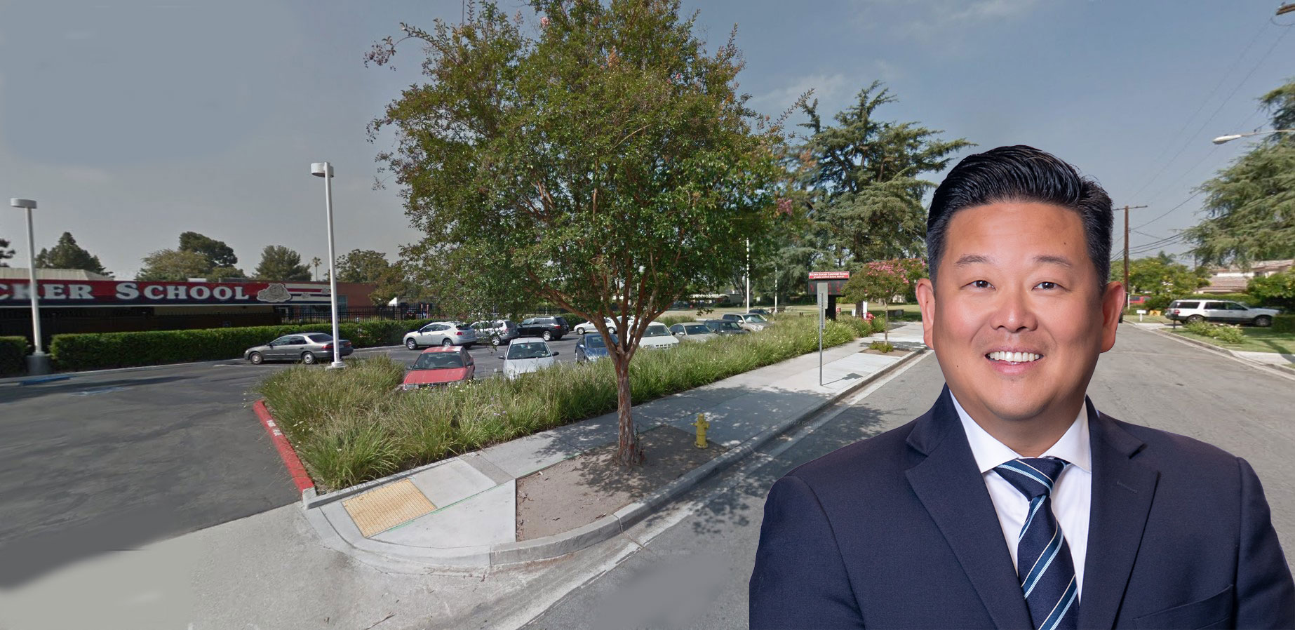 Steve's headshot in front of a neighborhood.